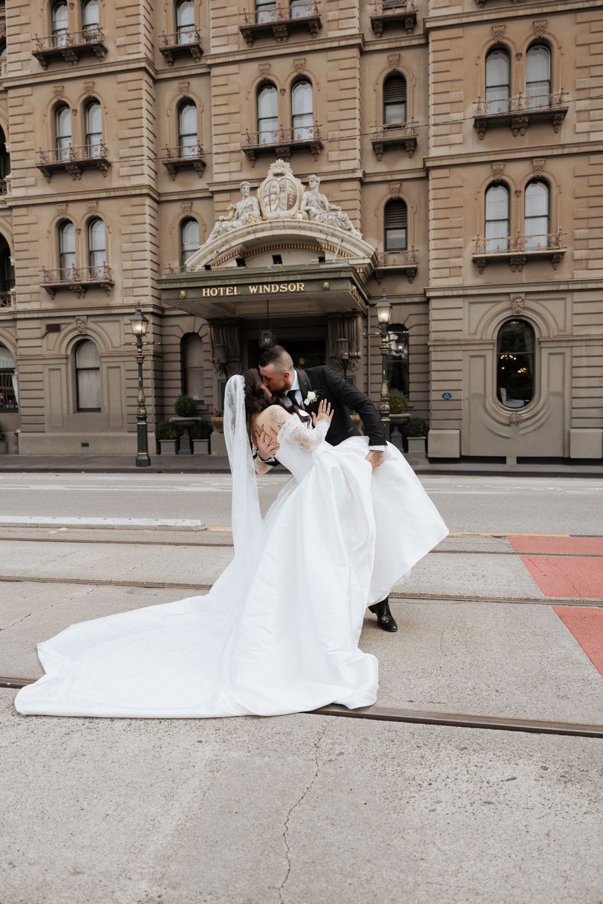 Bride and groom on the steps of a grand heritage Melbourne building