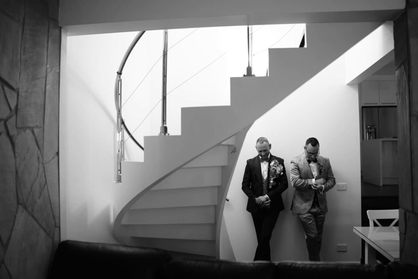 Groom on a staircase in black and white — cinematic Melbourne wedding film