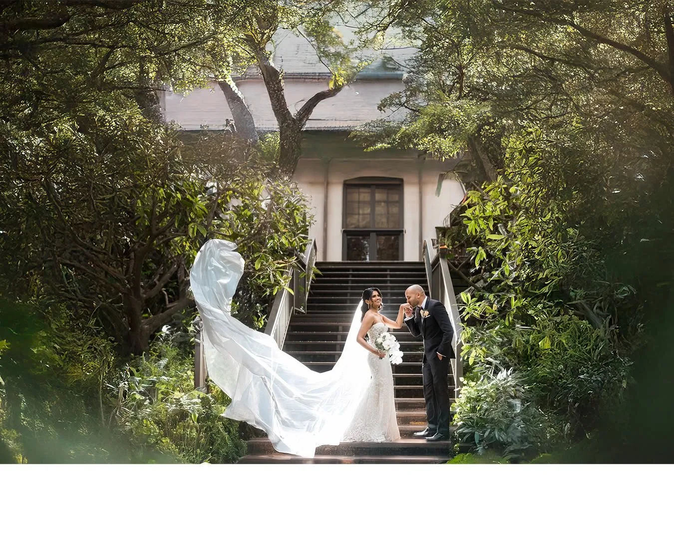 Bride and groom on garden steps at a Melbourne wedding venue