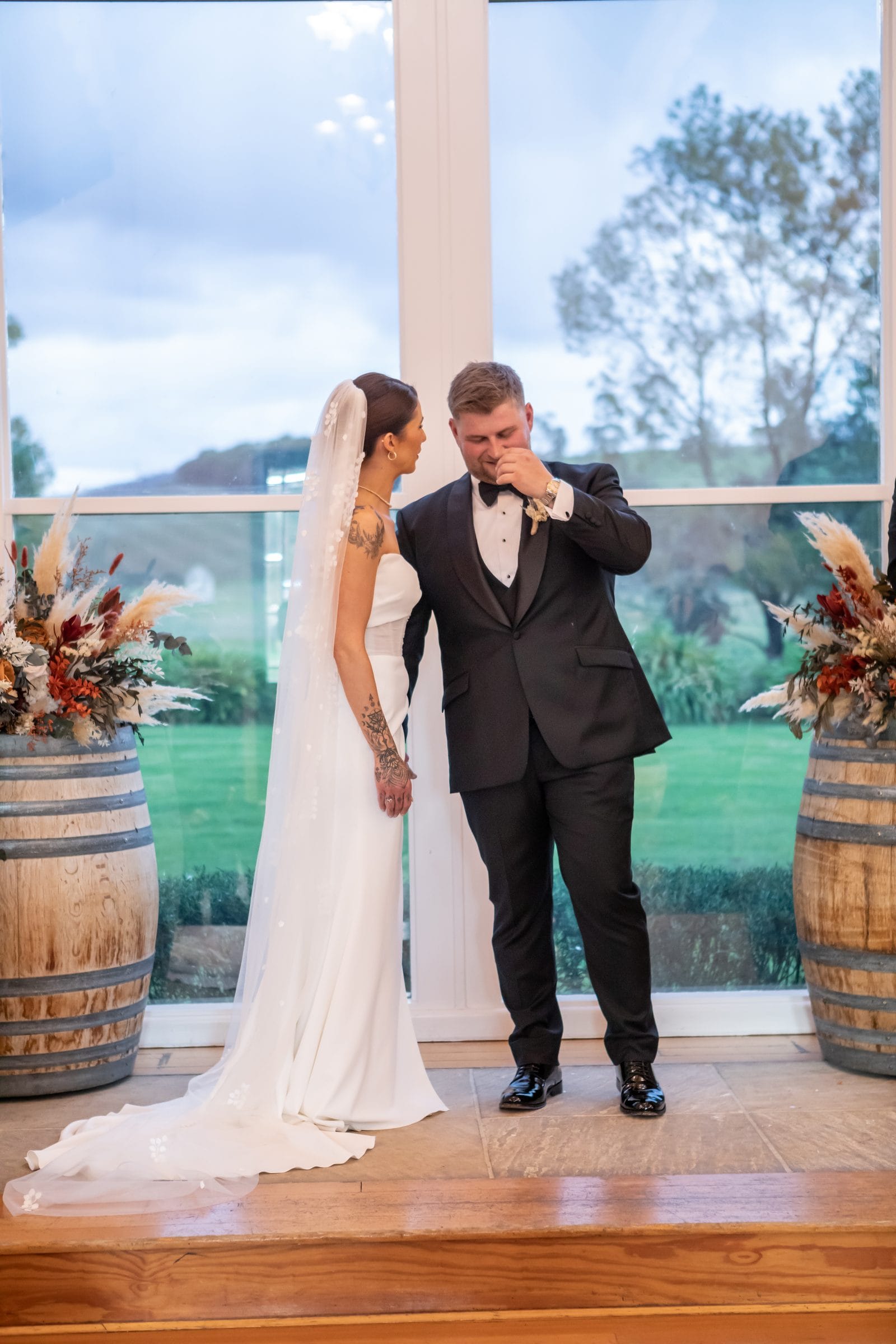 Couple sharing a moment during their wedding ceremony at Immerse Winery
