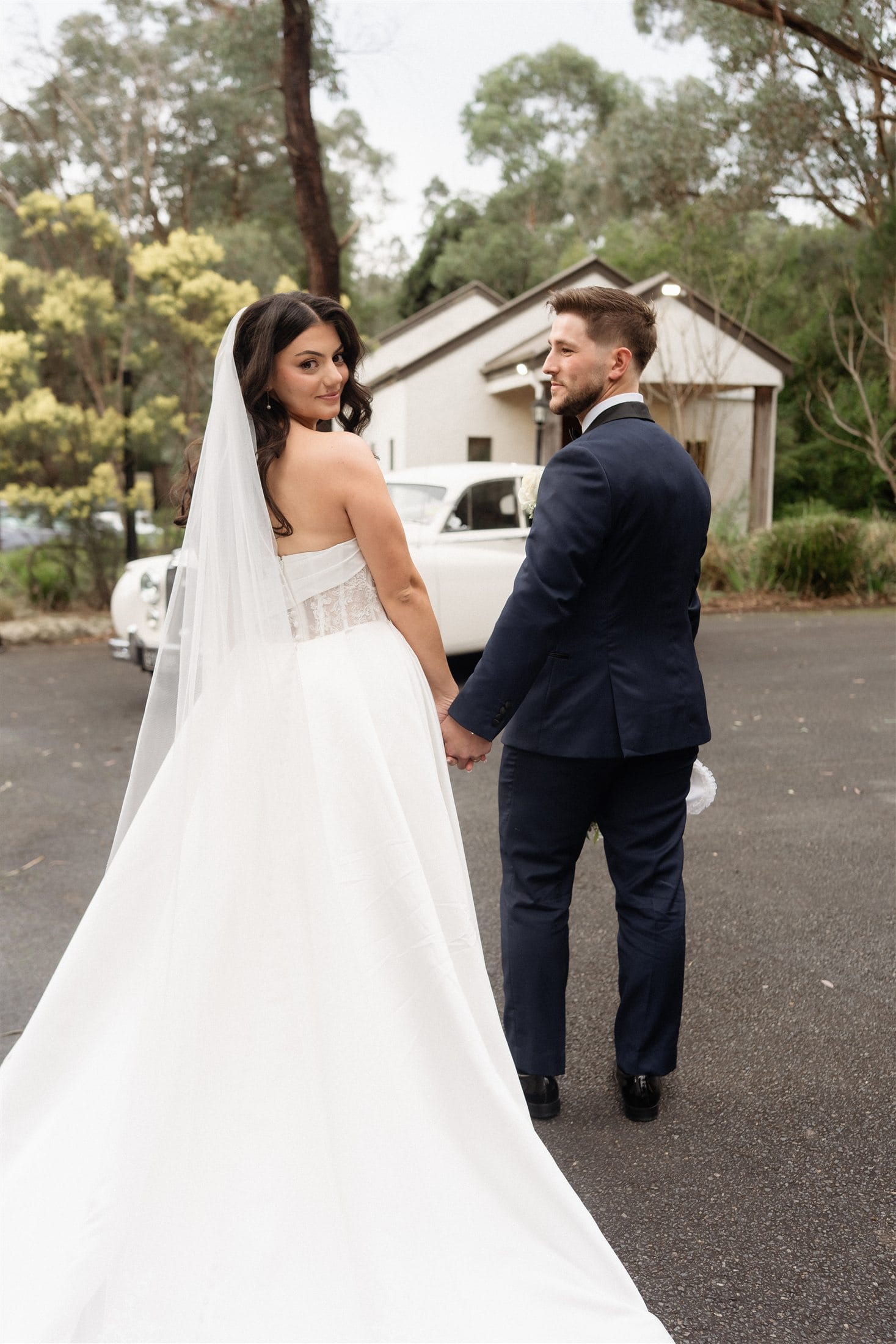 Afonso and Agnes walking hand in hand after their ceremony
