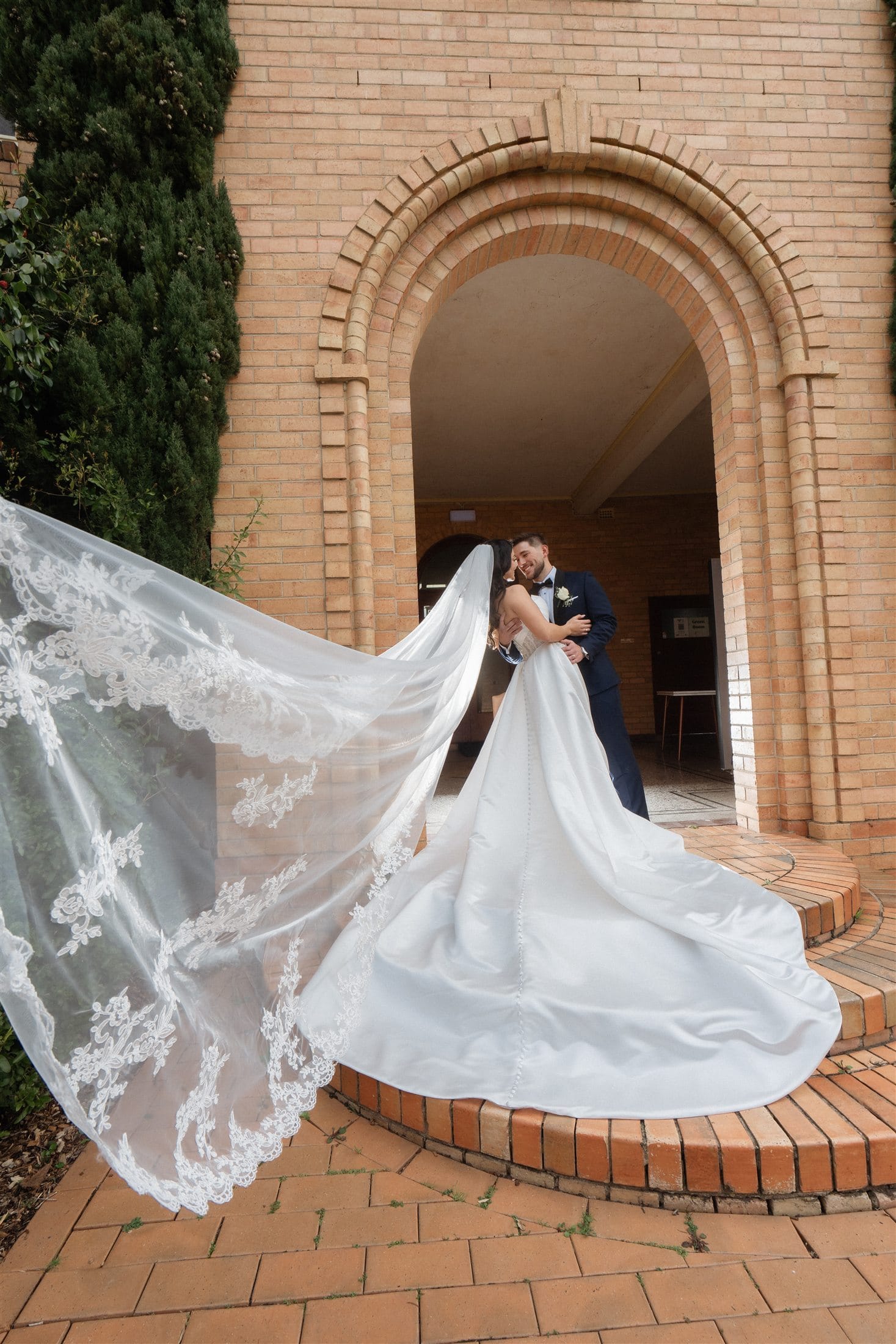 Afonso and Agnes close together during their wedding portraits