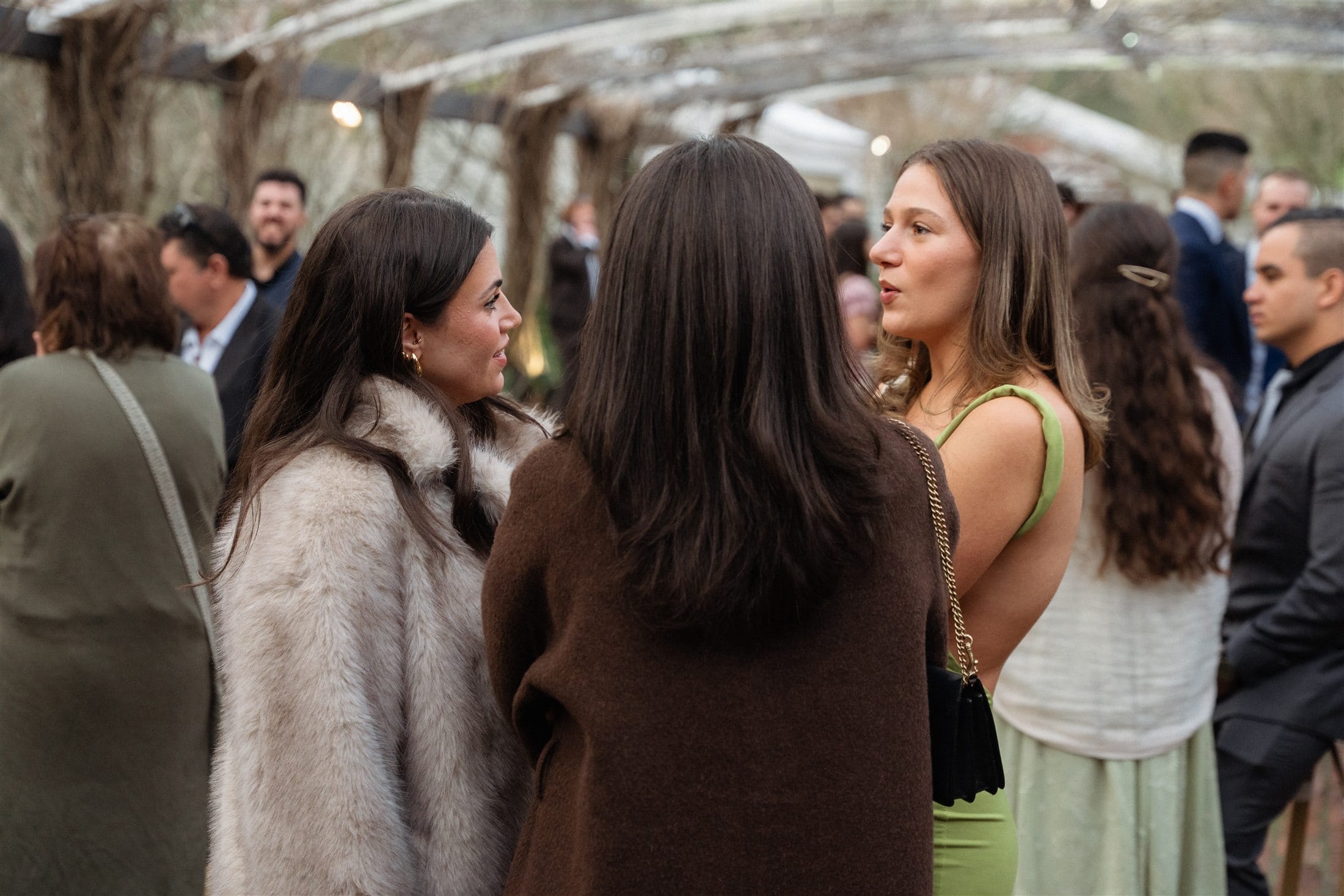 Guests sharing a candid moment at the Potters wedding reception